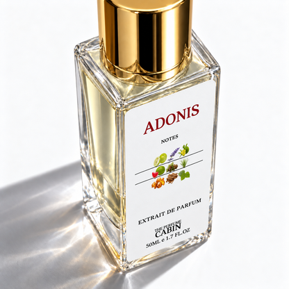 A clear glass perfume bottle with a reflective gold cap and a white label reading ADONIS NOTES, photographed on a bright white background with sharp sunlight shadows.