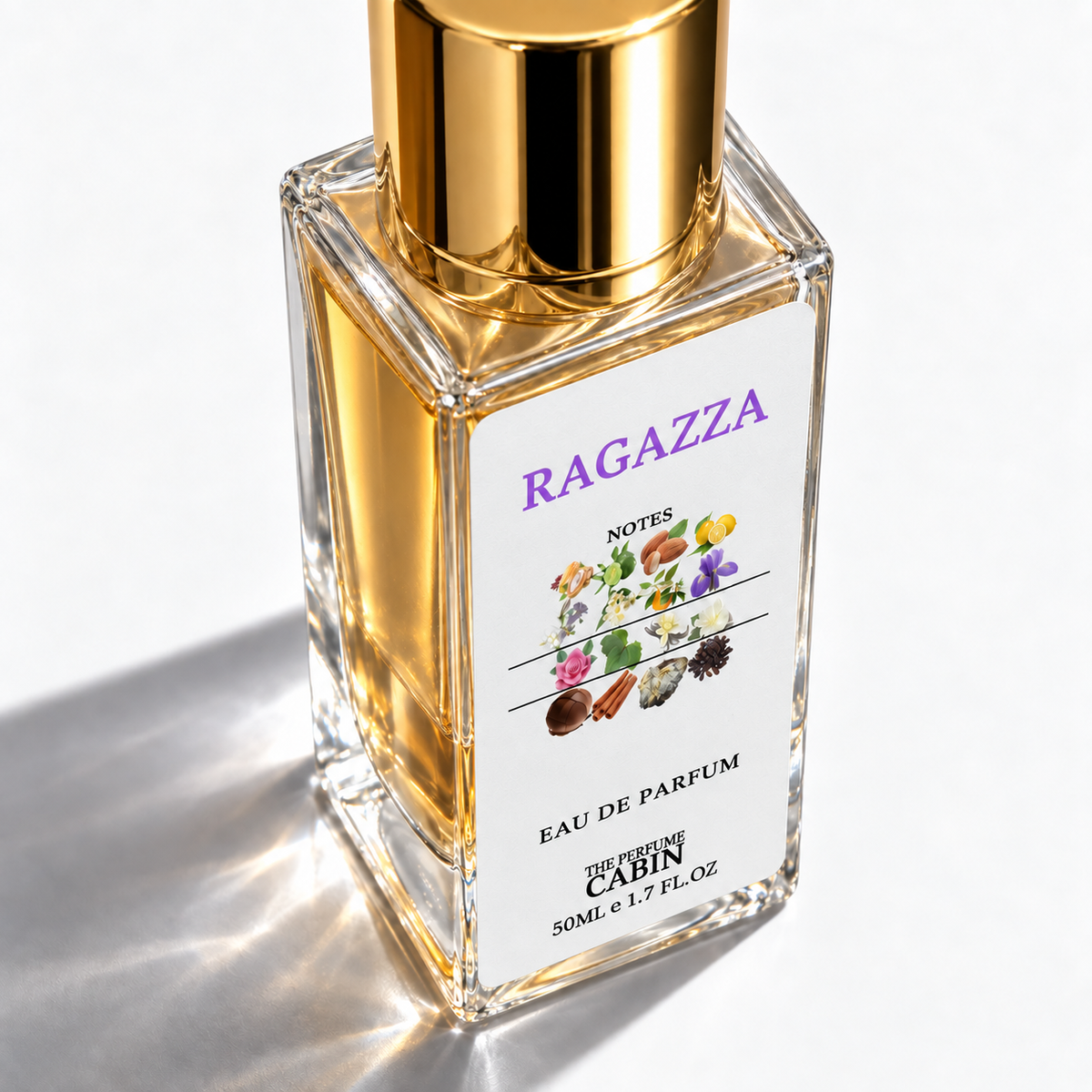 A square glass perfume bottle with a shiny gold cap and a white label reading 'RAGAZZA' and 'EAU DE PARFUM'. The bottle is filled with golden liquid and photographed on a clean white background with a soft shadow.