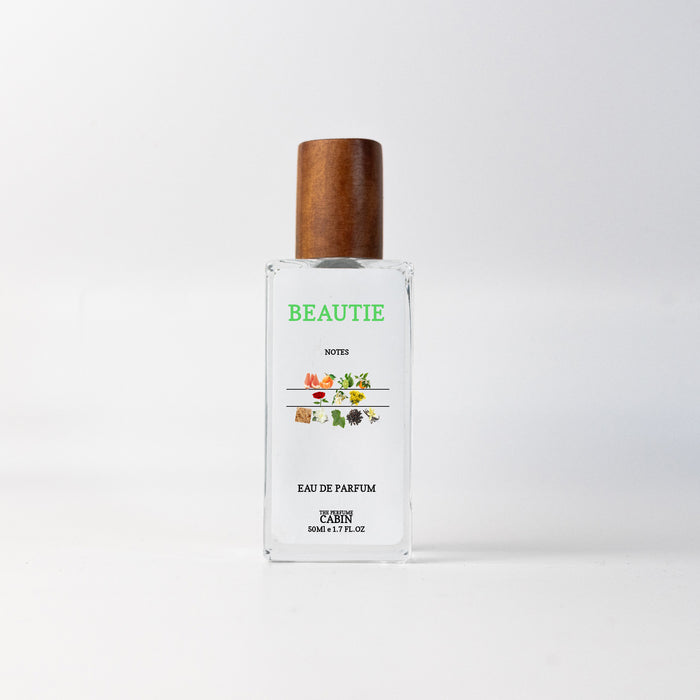 BEAUTIE extrait de parfum, glass bottle with gold cap on white - juicy citrus over soft rose and jasmine grounded in patchouli, inspired by Chanel Coco Mademoiselle