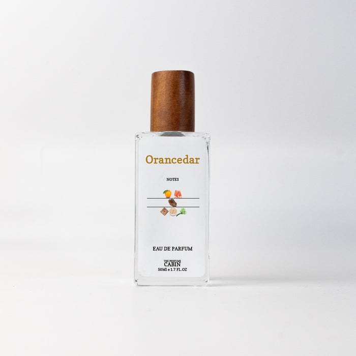 ORANCEDAR extrait de parfum, glass bottle with gold cap on white - zesty orange and grapefruit over earthy cedar and vetiver, inspired by Terre d'Hermes