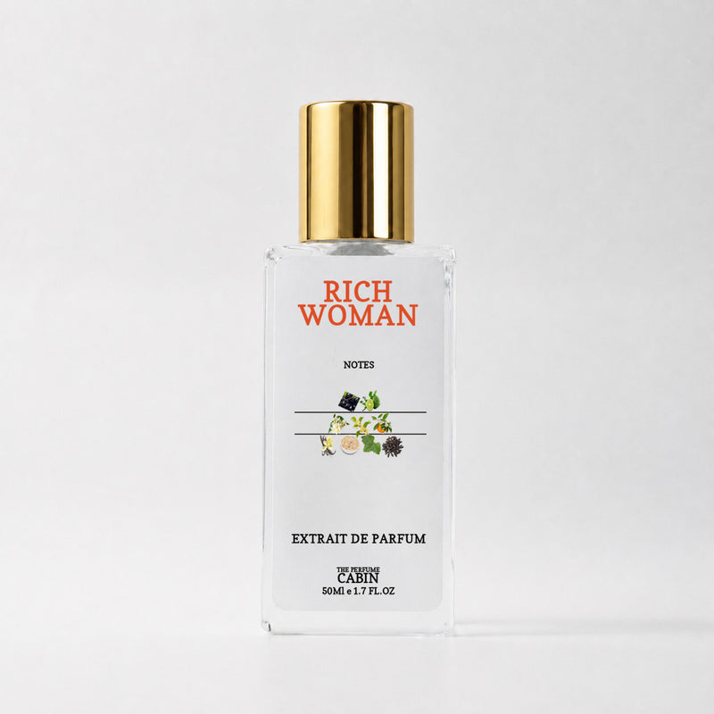 RICH WOMAN extrait de parfum, glass bottle with gold cap on white - freesia and orchid over sweet patchouli and vanilla, inspired by Viktor and Rolf Flowerbomb